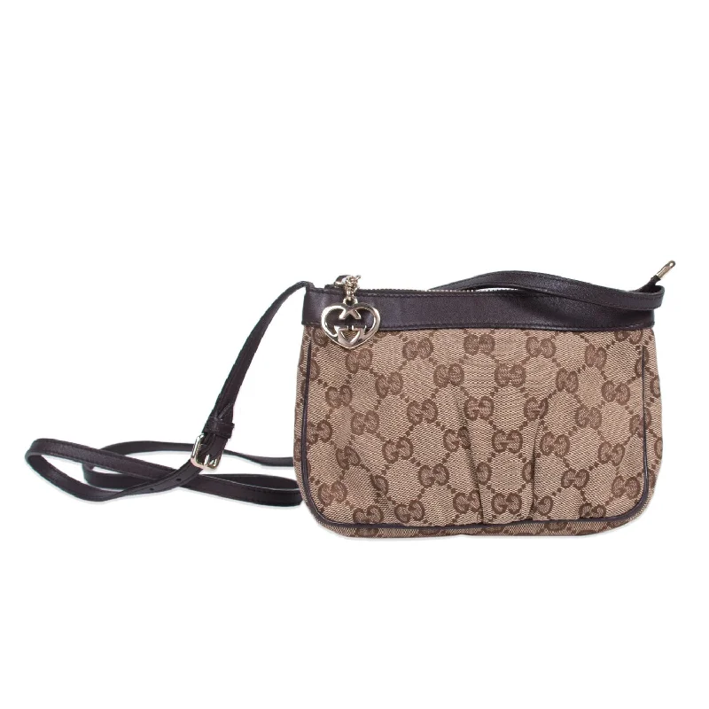 Gucci Marmont bags for women with a snakeskin - effect panelGucci GG Canvas Mini Cross Body Bag