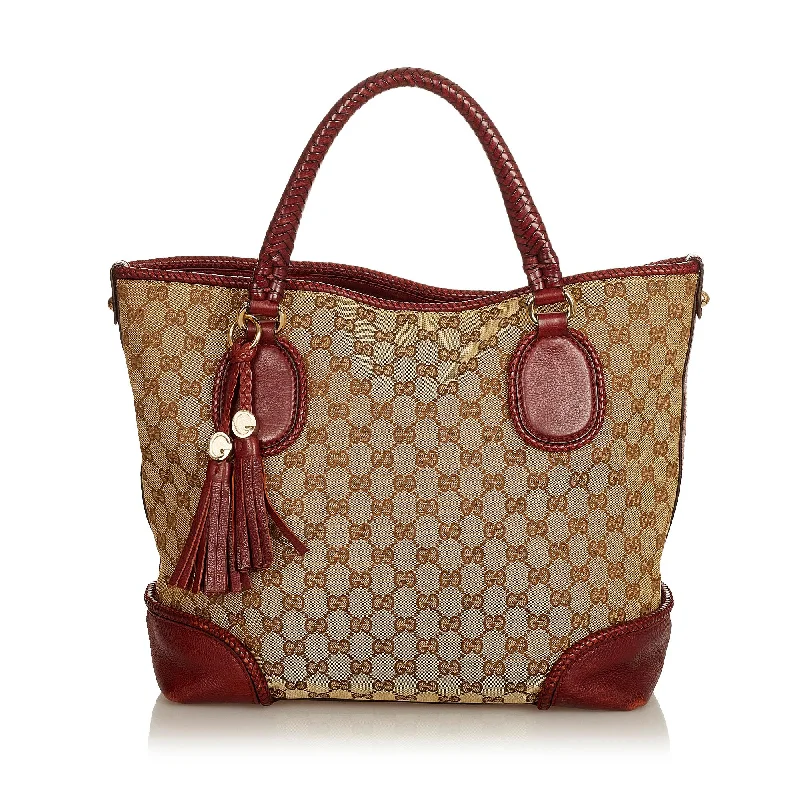 Gucci Marmont bags for women with a snakeskin - effect panelGucci GG Canvas Marrakech Tote Bag