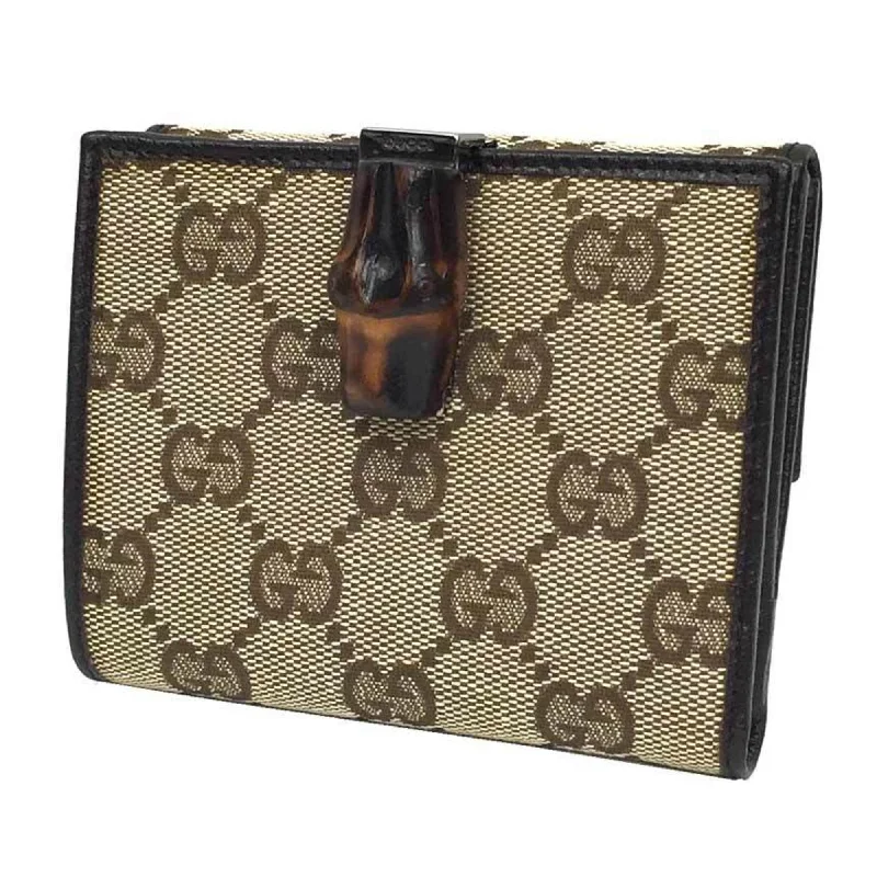 Women Gucci Sylvie bags featuring the signature web stripeGucci GG canvas fold wallet (coin purse) beige x dark brown WG