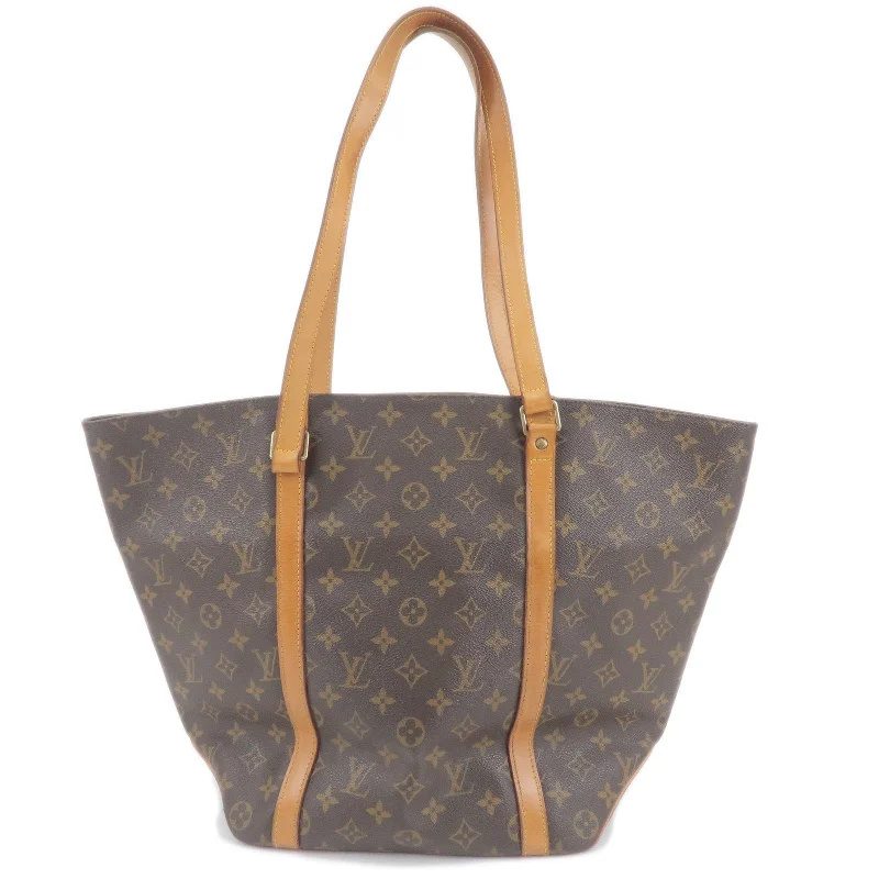 Ladies Louis Vuitton shoulder bags with a tassel decoration for charmLouis Vuitton Monogram Sac Shopping Shoulder Bag M51108