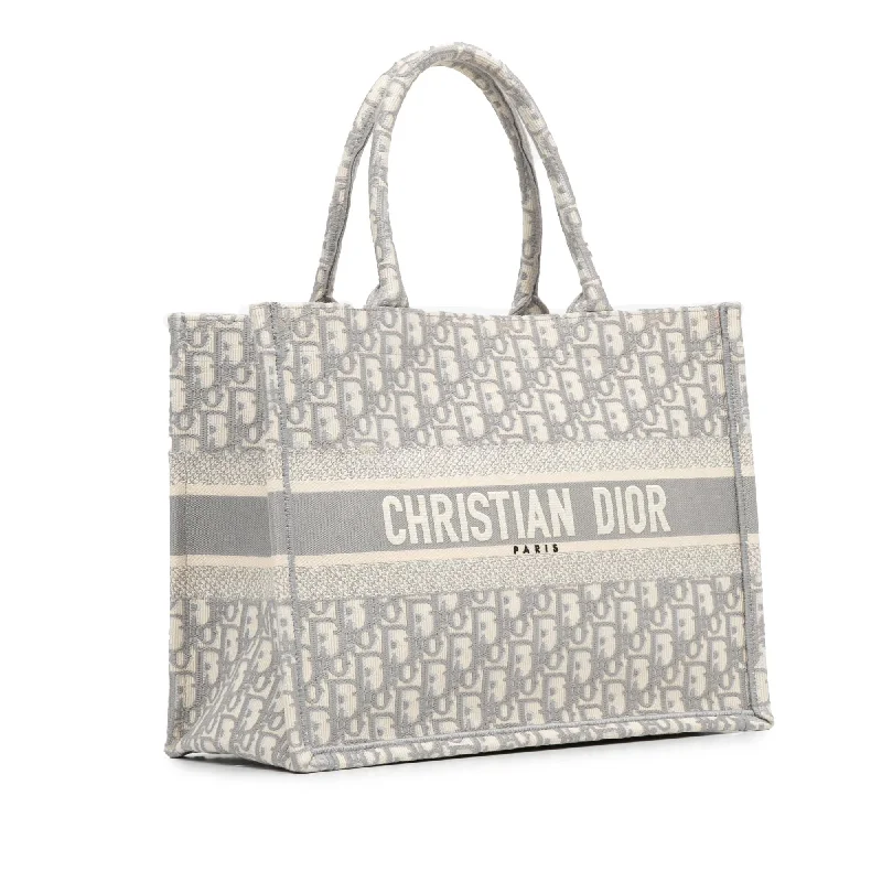 Christian Dior bags with a side - pocket for holding a water bottleDior Medium Oblique Book Tote (xR40My)